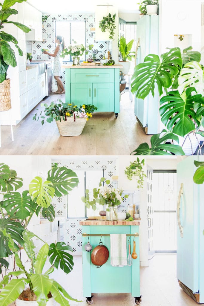 bright and airy modern farmhouse kitchen with bohemian style colorful DIY kitchen island, portable kitchen cart on wheels with hanging rail, mint fridge, mostera and fiddle leaf fig plants