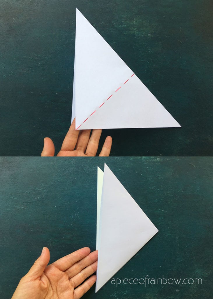  Fold the large triangle (from Step 1) in half to make a smaller triangle