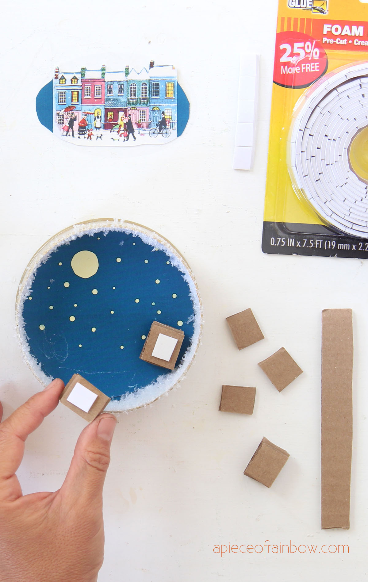 Make cardboard stacks to lift up the image to create depth.