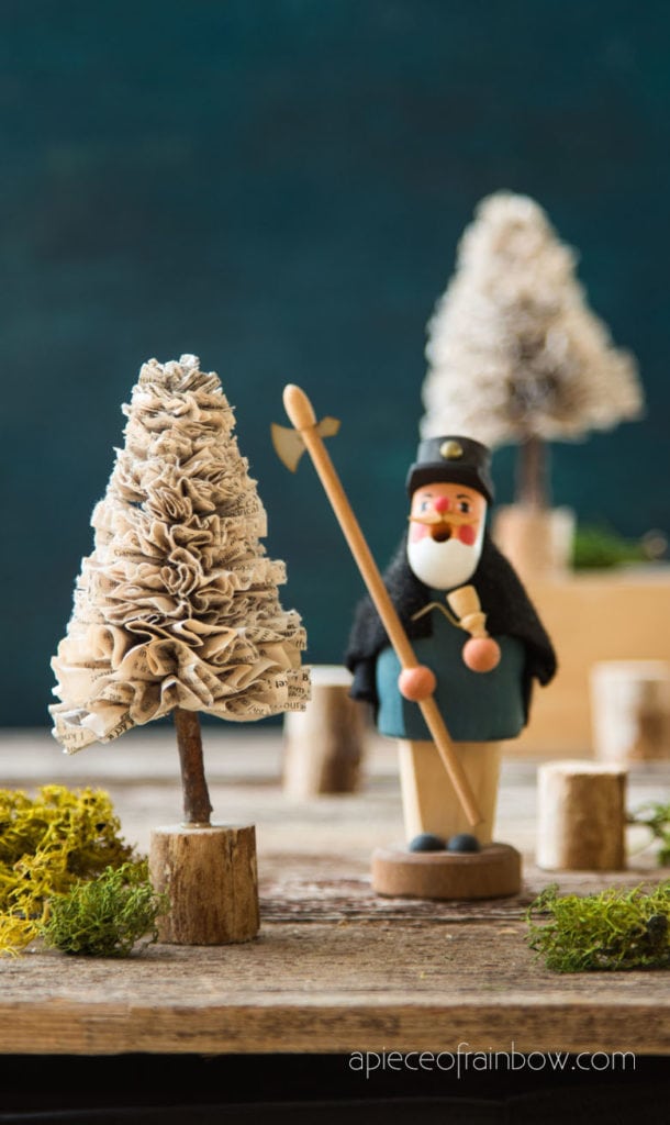 decorating with DIY paper Christmas trees and green moss