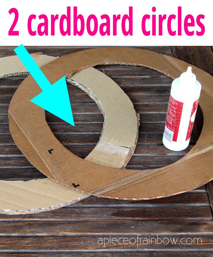 glue together 2 cardboard rings to form a wreath shape