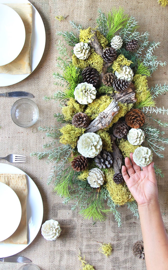farmhouse table decorations with white pine cones and moss