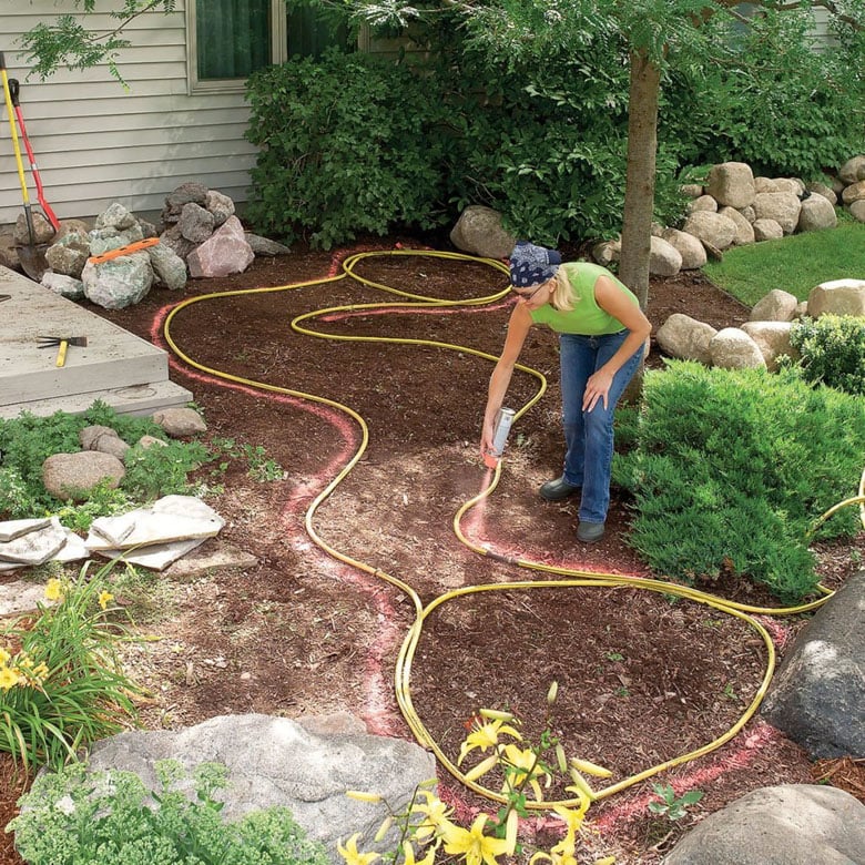 design a backyard DIY garden pond with stream