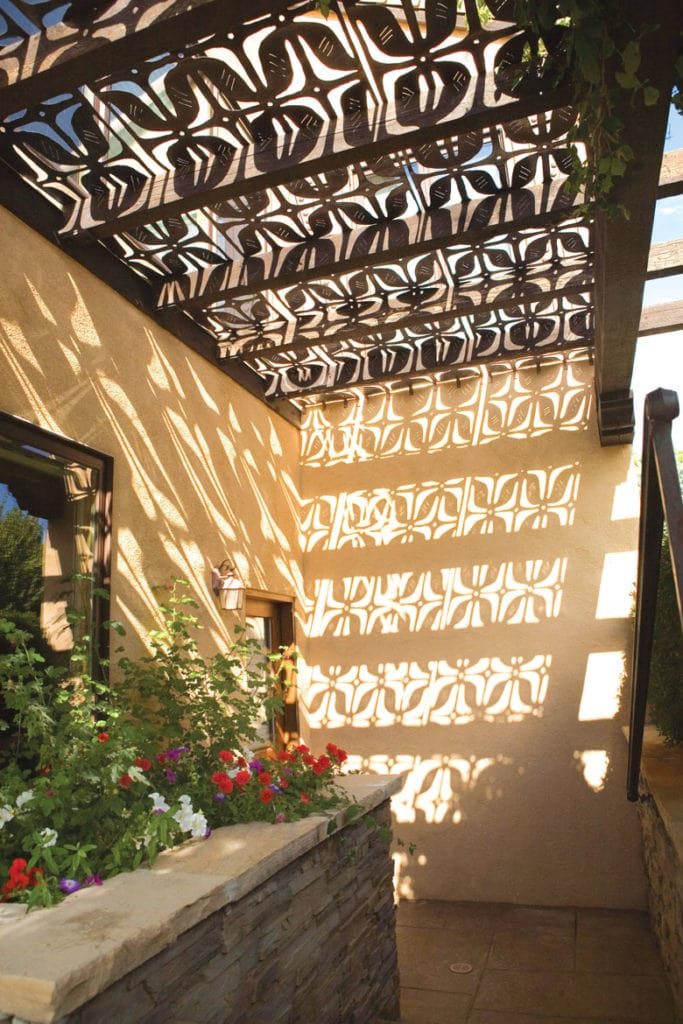 metal pergola shade structures with decorative cutout patterns also create beautiful shadows on walls and floors