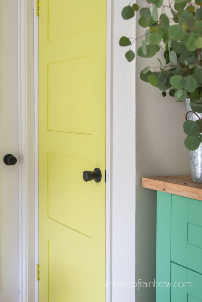 colorful boho and farmhouse style DIY painted lime yellow door  with modern black knob