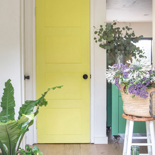 Transform an old hollow core door into boho and farmhouse style DIY painted panel door for under $20! Easy makeover with simple tools and materials. Great home improvement idea on a budget! - A Piece Of Rainbow