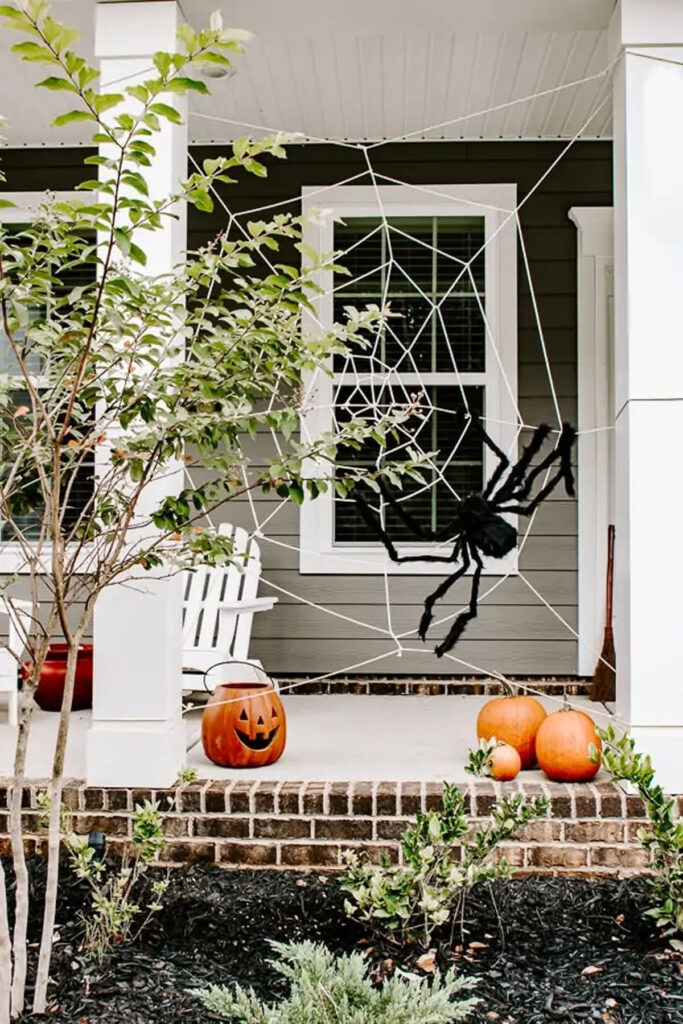 Make a large spiderweb to decorate your Halloween porch