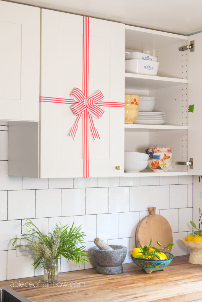 boho modern farmhouse Christmas kitchen cabinet decorations with paper bow & ribbons