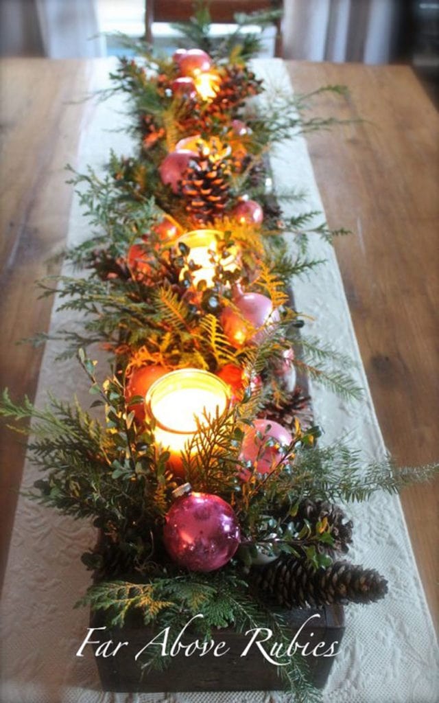 Christmas centerpiece in a long box with candles