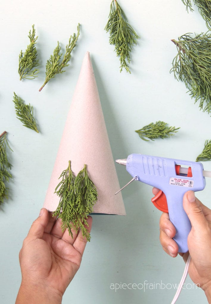 glue small branches to Christmas tree paper cone