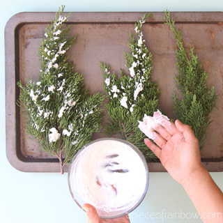 Best $1 DIY snow flocking to make beautiful flocked Christmas trees, branches, & farmhouse decorations. Easy winter crafts for kids and family!