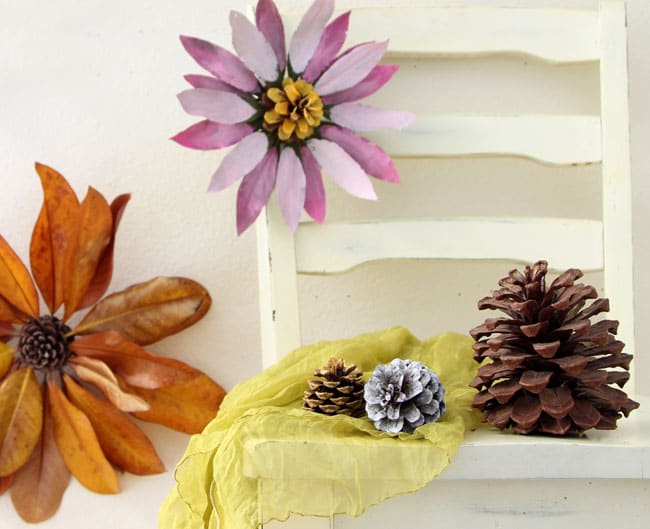 How to make flowers from nature walk findings such as pine cones and leaves. These giant blossoms make such dramatic, beautiful and free home decorations! via A Piece Of Rainbow