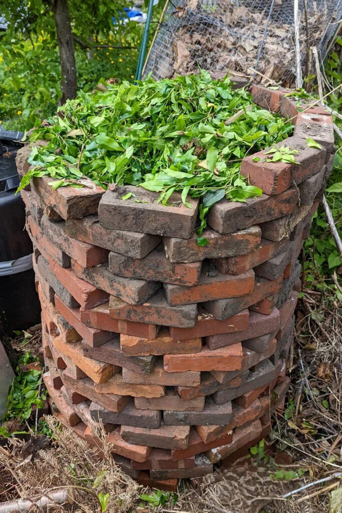 Stacked brick compost bin