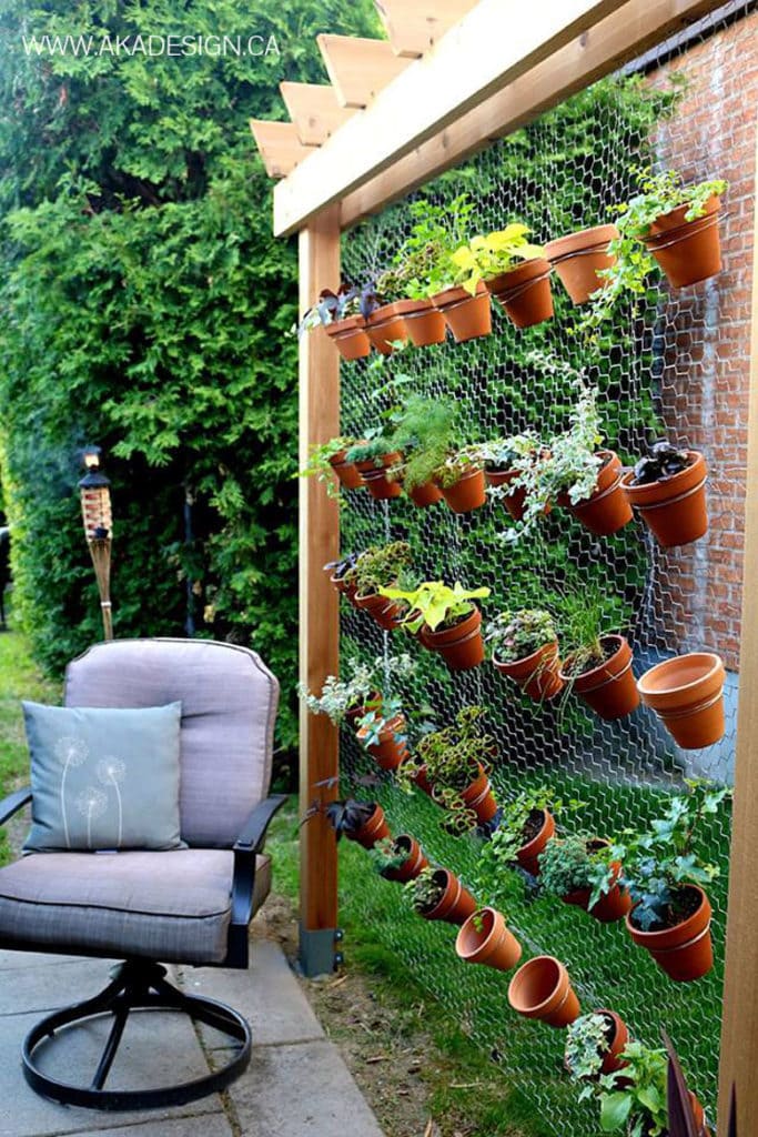  vertical gardens using pots on a garden screen