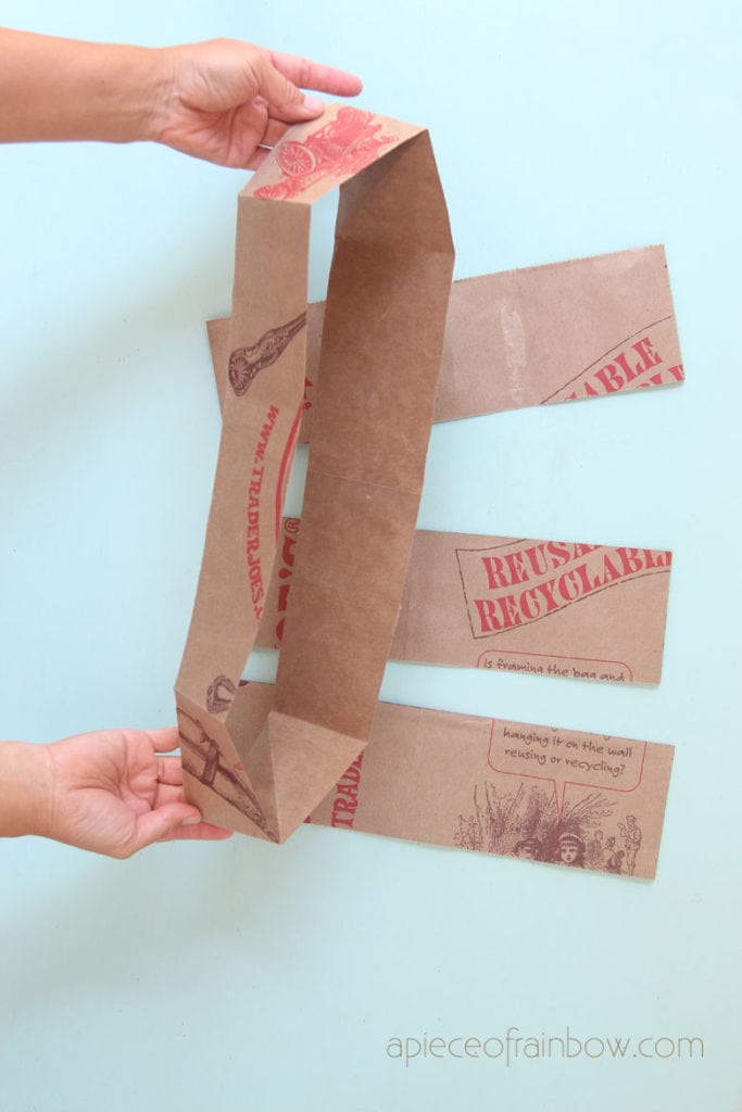 Open up each cut paper bag section